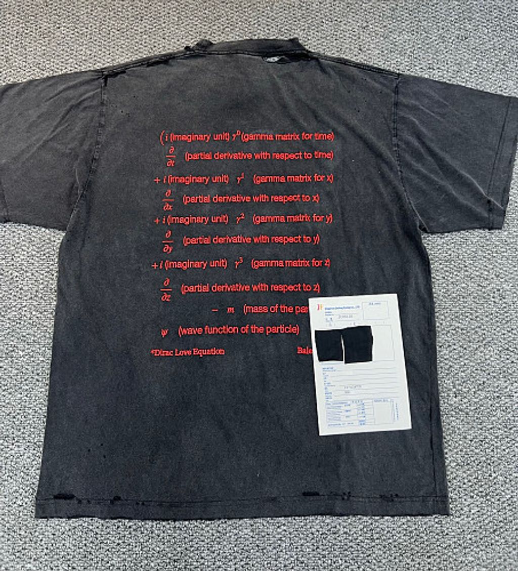 Front and back view of the Balenciaga Dirac Equation embroidered t-shirt in washed black, featuring red physics equation embroidery on the chest, explanatory text on the back, and hand-distressed collar and cuffs. Available in Singapore and Malaysia.