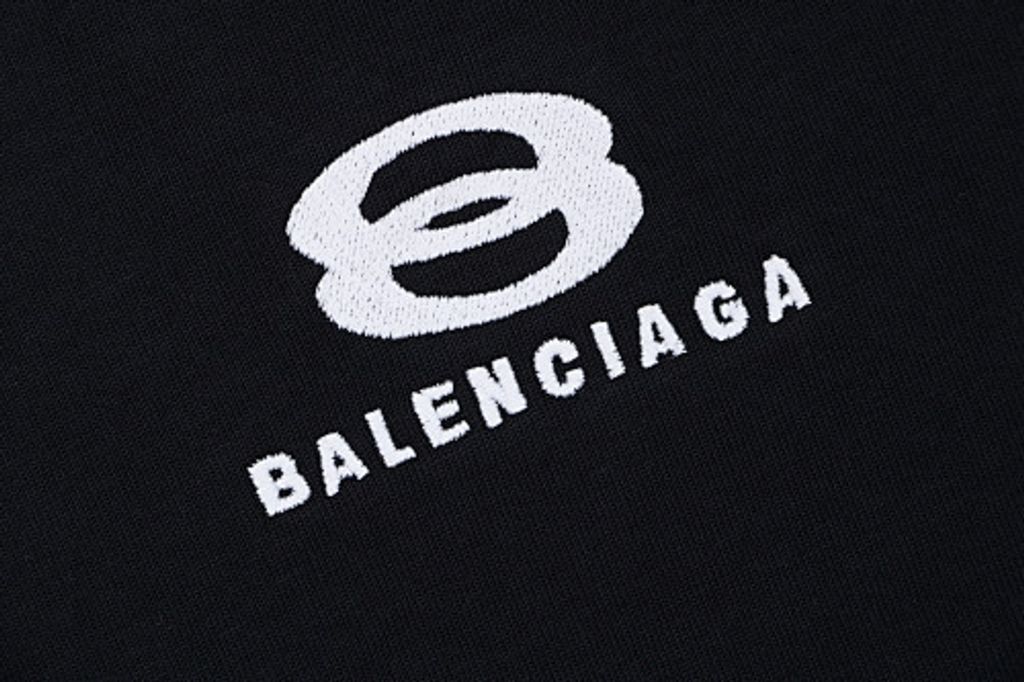 Front and back view of the Balenciaga Double Ring stripe t-shirt in black, featuring red and white racing stripes on the shoulders, a double-ring logo on the chest, and a relaxed oversized fit. Available in Singapore and Malaysia.
