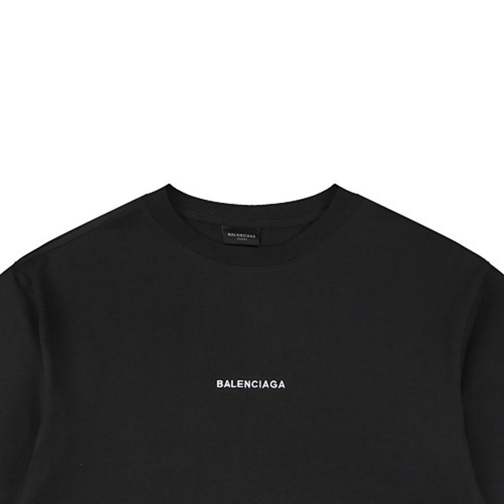 Front and back view of the Balenciaga Double Lion Emblem t-shirt in black, featuring a center chest logo, embroidered lion crests on the sleeves, and a relaxed oversized fit. Available in Singapore and Malaysia.