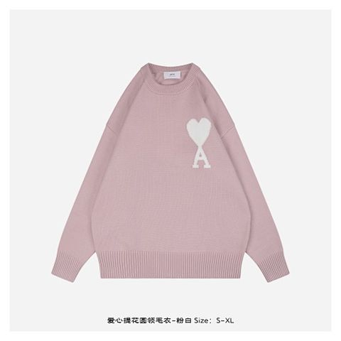 Front and back view of the AMI Paris Ami de Coeur intarsia crewneck sweater in soft pink, featuring a large white knitted "A" heart logo on the chest and a relaxed drop-shoulder fit. Available in Singapore and Malaysia.