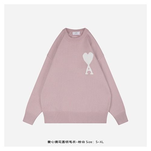 Front and back view of the AMI Paris Ami de Coeur intarsia crewneck sweater in soft pink, featuring a large white knitted "A" heart logo on the chest and a relaxed drop-shoulder fit. Available in Singapore and Malaysia.