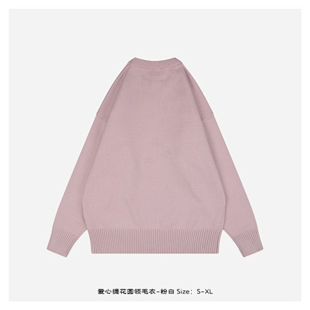 Front and back view of the AMI Paris Ami de Coeur intarsia crewneck sweater in soft pink, featuring a large white knitted "A" heart logo on the chest and a relaxed drop-shoulder fit. Available in Singapore and Malaysia.
