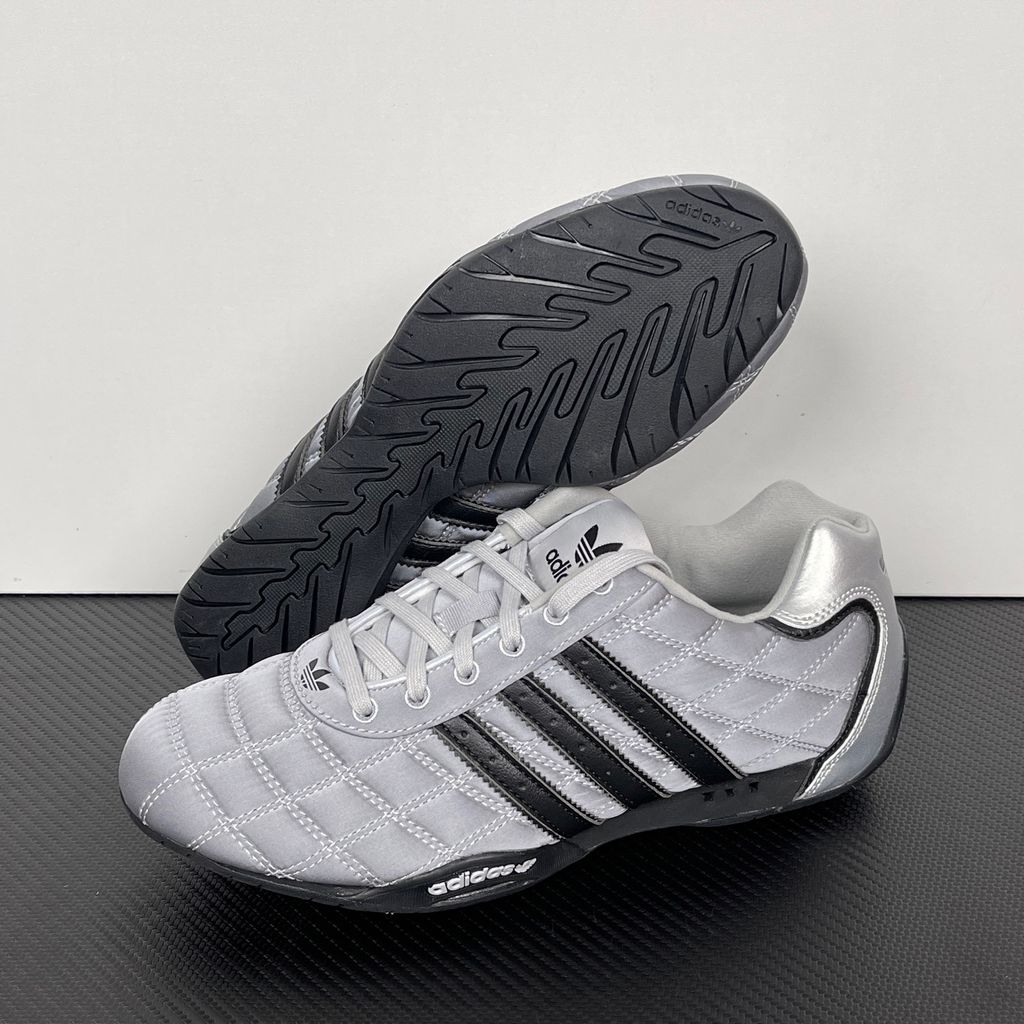Side profile of women's adidas Adi Racer Low sneaker JS0284, featuring a sleek metallic silver upper, black 3-stripes, and a low-profile motorsport rubber outsole. Available in Singapore and Malaysia..jpg