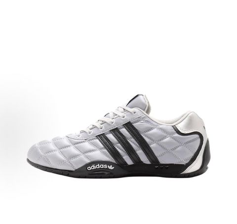 Side profile of women's adidas Adi Racer Low sneaker JS0284, featuring a sleek metallic silver upper, black 3-stripes, and a low-profile motorsport rubber outsole. Available in Singapore and Malaysia.