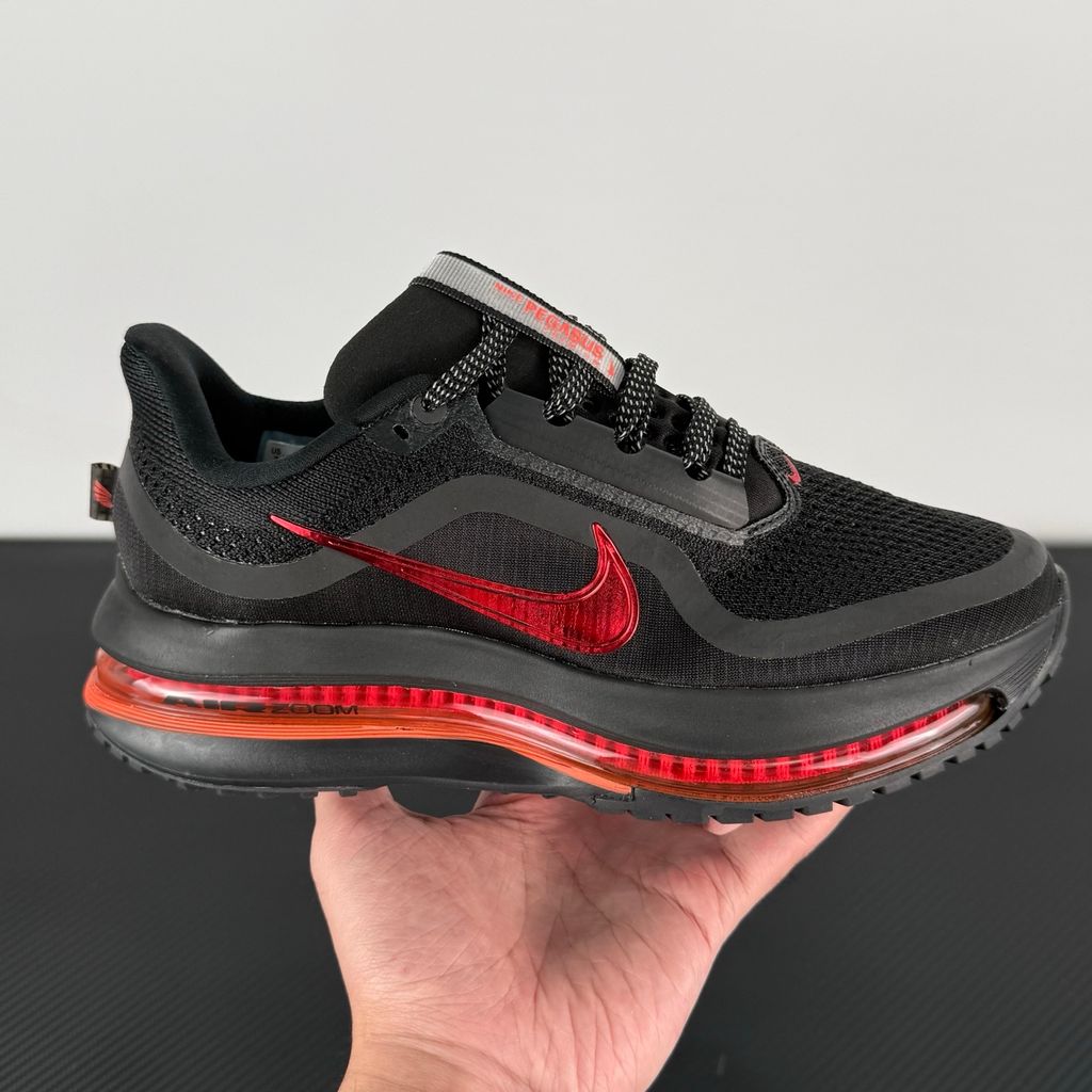 Side profile of the Nike Air Zoom Pegasus Premium running shoe HQ2593-010 in Hot Lava, featuring a vibrant red-orange knit upper, a sculpted visible Zoom Air unit, and a thick ZoomX midsole. Available in Singapore and Malaysia.