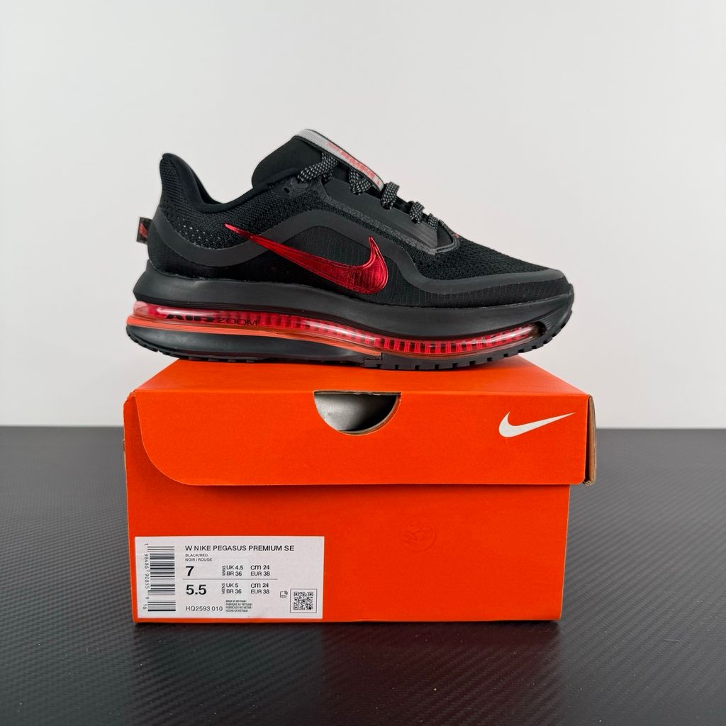 Side profile of the Nike Air Zoom Pegasus Premium running shoe HQ2593-010 in Hot Lava, featuring a vibrant red-orange knit upper, a sculpted visible Zoom Air unit, and a thick ZoomX midsole. Available in Singapore and Malaysia.