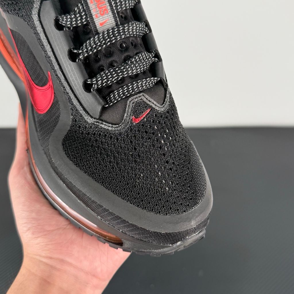 Side profile of the Nike Air Zoom Pegasus Premium running shoe HQ2593-010 in Hot Lava, featuring a vibrant red-orange knit upper, a sculpted visible Zoom Air unit, and a thick ZoomX midsole. Available in Singapore and Malaysia.