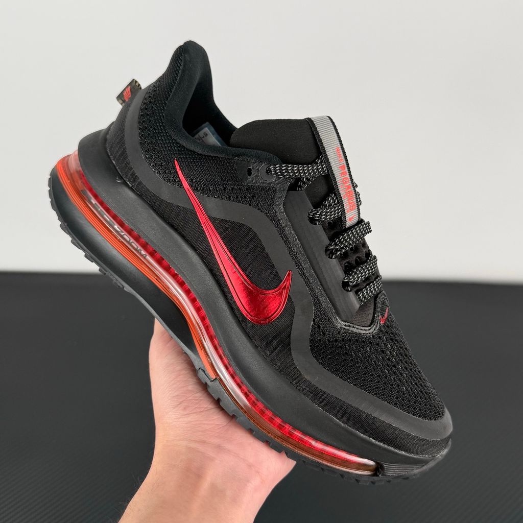 Side profile of the Nike Air Zoom Pegasus Premium running shoe HQ2593-010 in Hot Lava, featuring a vibrant red-orange knit upper, a sculpted visible Zoom Air unit, and a thick ZoomX midsole. Available in Singapore and Malaysia.