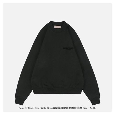Front and back view of the black Fear of God Essentials crewneck sweatshirt, featuring a tonal black flocked logo on the chest and back, with a relaxed drop-shoulder fit. Available in Singapore and Malaysia.