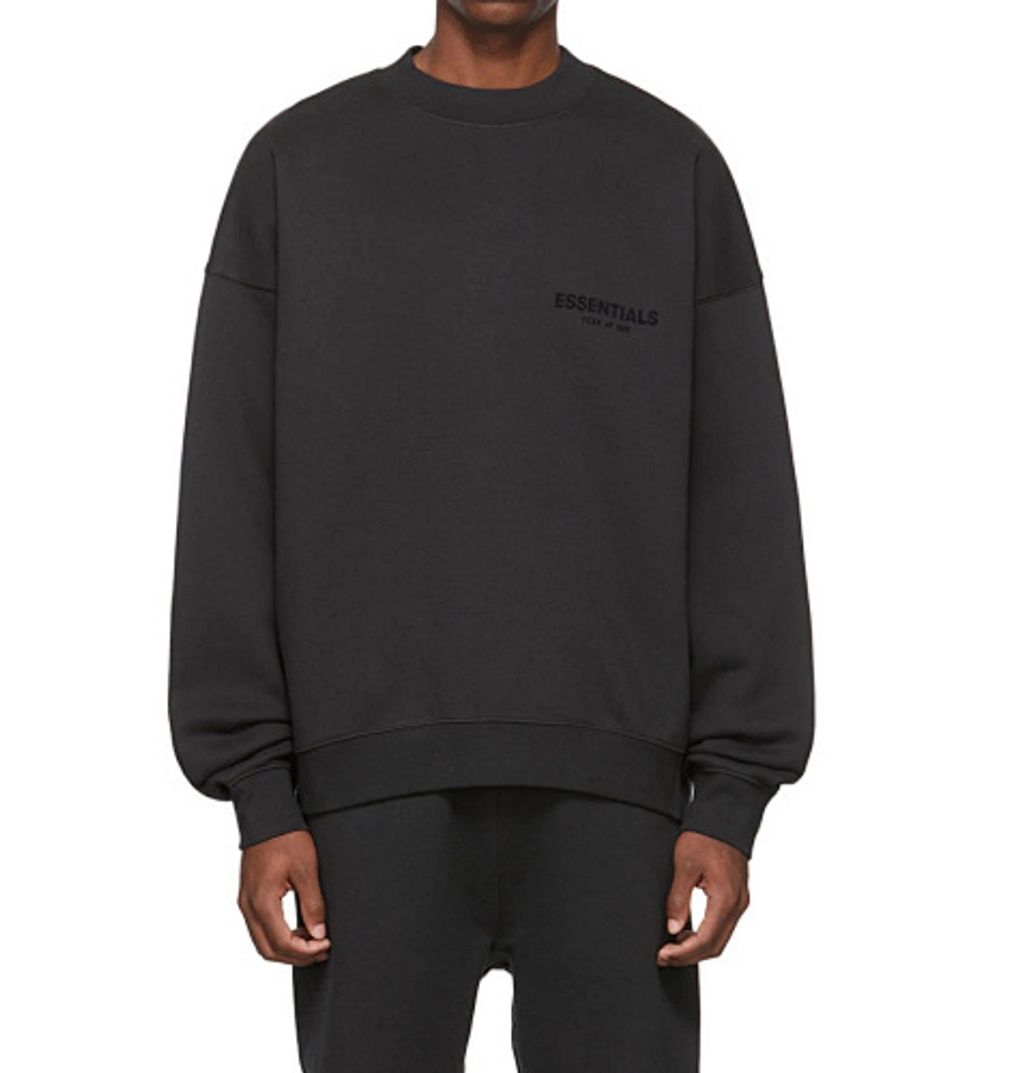 Front and back view of the black Fear of God Essentials crewneck sweatshirt, featuring a tonal black flocked logo on the chest and back, with a relaxed drop-shoulder fit. Available in Singapore and Malaysia.