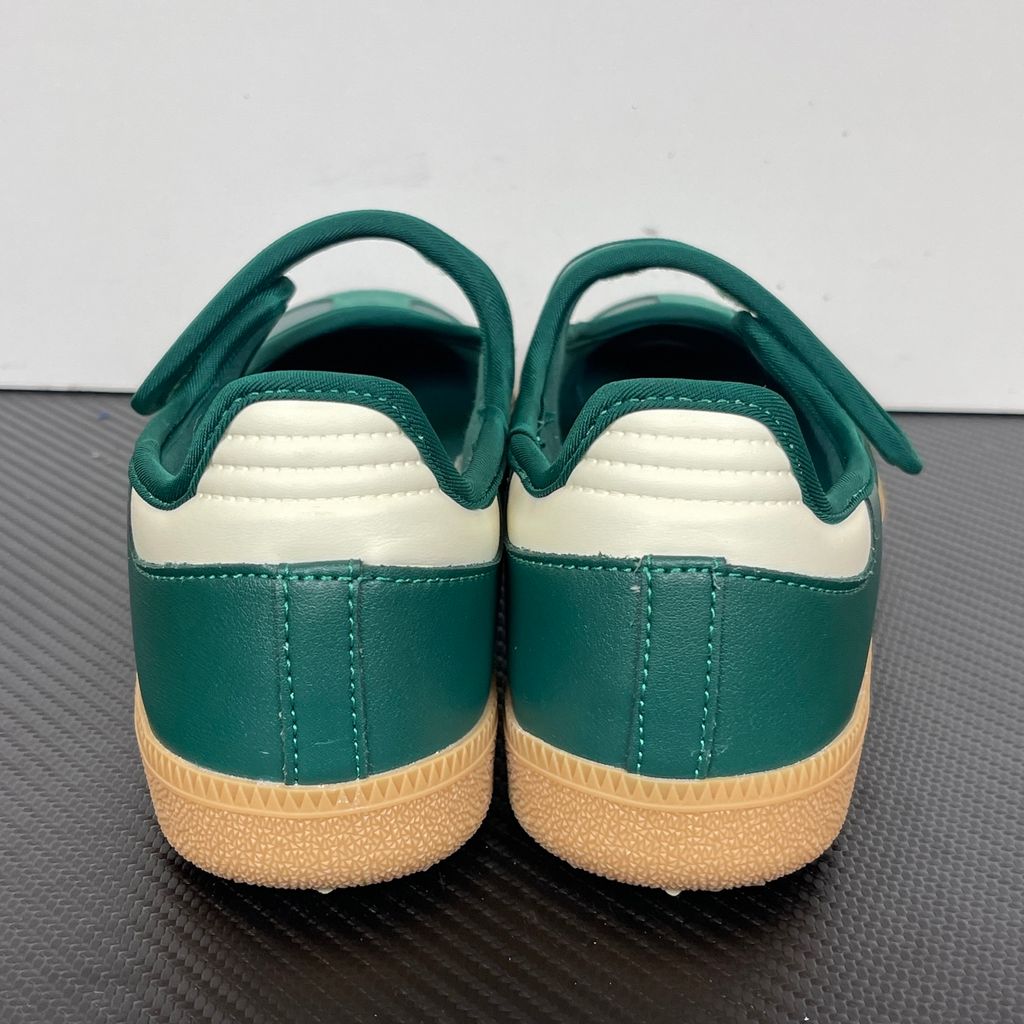 Side profile of the adidas Samba Jane Green White Gum Women's sneaker JR7340, featuring a rich green upper, crisp white serrated 3-Stripes, an adjustable midfoot strap, and a classic gum rubber outsole. Available in Singapore and Malaysia..jpg
