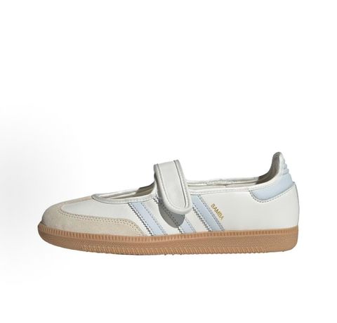 Side profile of the adidas Samba Jane White Blue Gum Women's sneaker JR7339, featuring a clean white leather upper, vibrant blue serrated 3-Stripes, an adjustable midfoot strap, and a classic gum rubber outsole. Available in Singapore and Malaysia..pic_hd