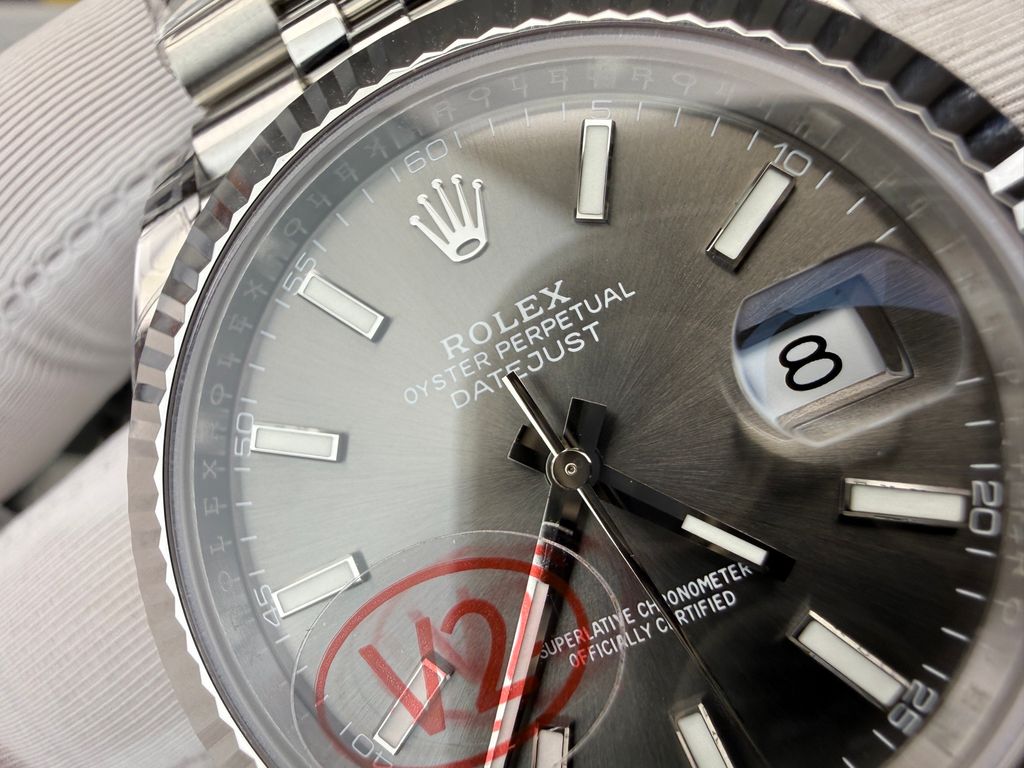 Front view of the Rolex Datejust 41 timepiece reference M126334-0014, featuring a slate sunray dial, an 18ct white gold fluted bezel, a date window with Cyclops lens, and an Oystersteel Jubilee bracelet. Available in Singapore and Malaysia..jpg