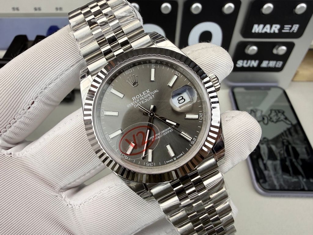 Front view of the Rolex Datejust 41 timepiece reference M126334-0014, featuring a slate sunray dial, an 18ct white gold fluted bezel, a date window with Cyclops lens, and an Oystersteel Jubilee bracelet. Available in Singapore and Malaysia..jpg
