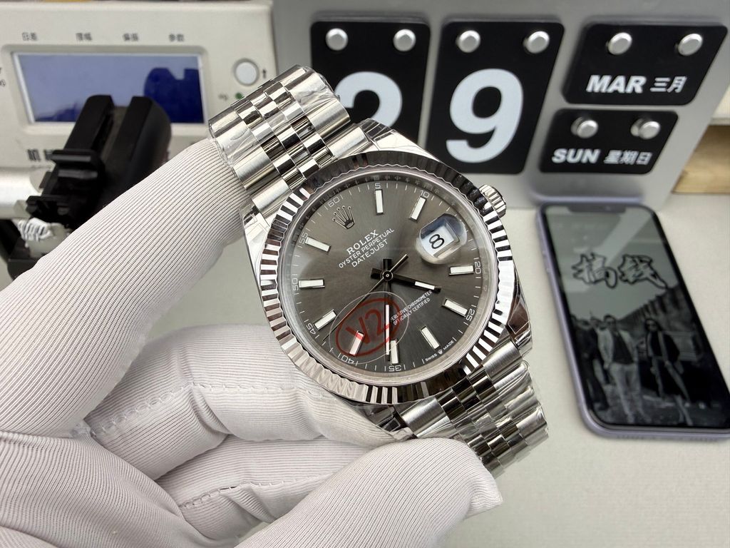 Front view of the Rolex Datejust 41 timepiece reference M126334-0014, featuring a slate sunray dial, an 18ct white gold fluted bezel, a date window with Cyclops lens, and an Oystersteel Jubilee bracelet. Available in Singapore and Malaysia..jpg