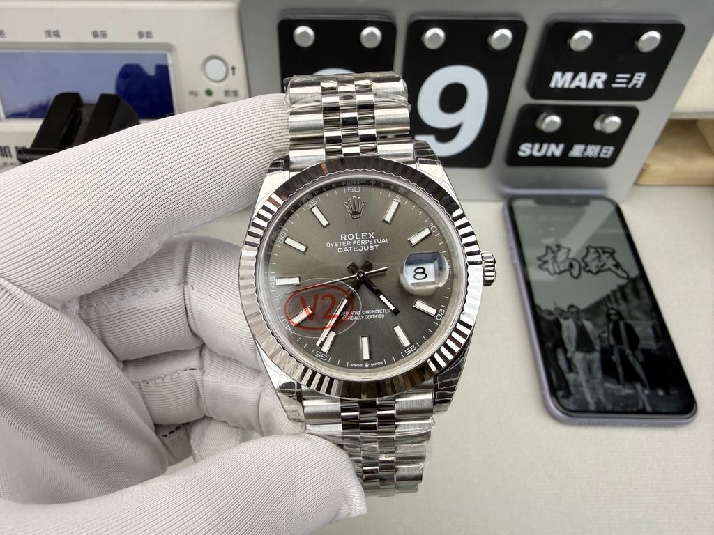 Front view of the Rolex Datejust 41 timepiece reference M126334-0014, featuring a slate sunray dial, an 18ct white gold fluted bezel, a date window with Cyclops lens, and an Oystersteel Jubilee bracelet. Available in Singapore and Malaysia..jpg
