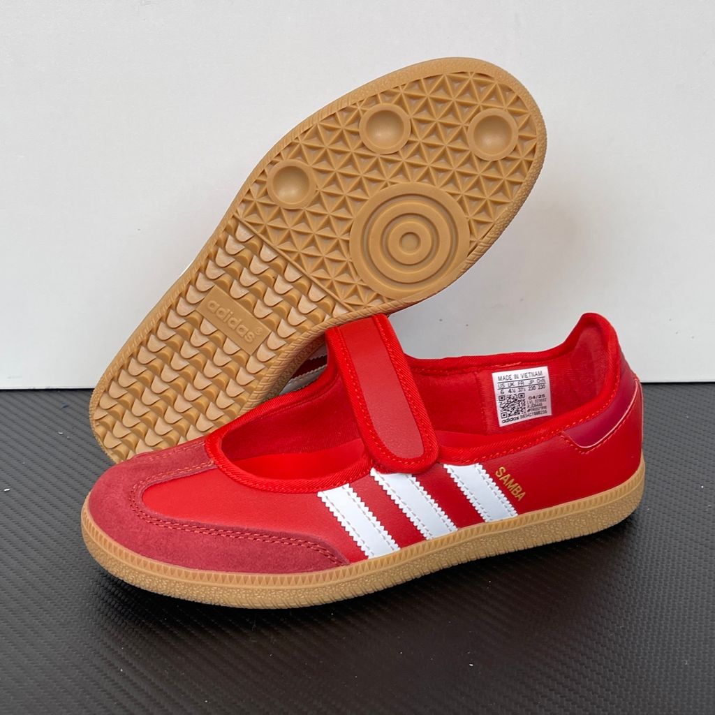 Side profile of the adidas Samba Jane Scarlet White Gum Women's sneaker JQ6446, featuring a vibrant red leather upper, crisp white serrated 3-Stripes, an adjustable midfoot strap, and a classic gum rubber outsole. Available in Singapore and Malaysia..jpg