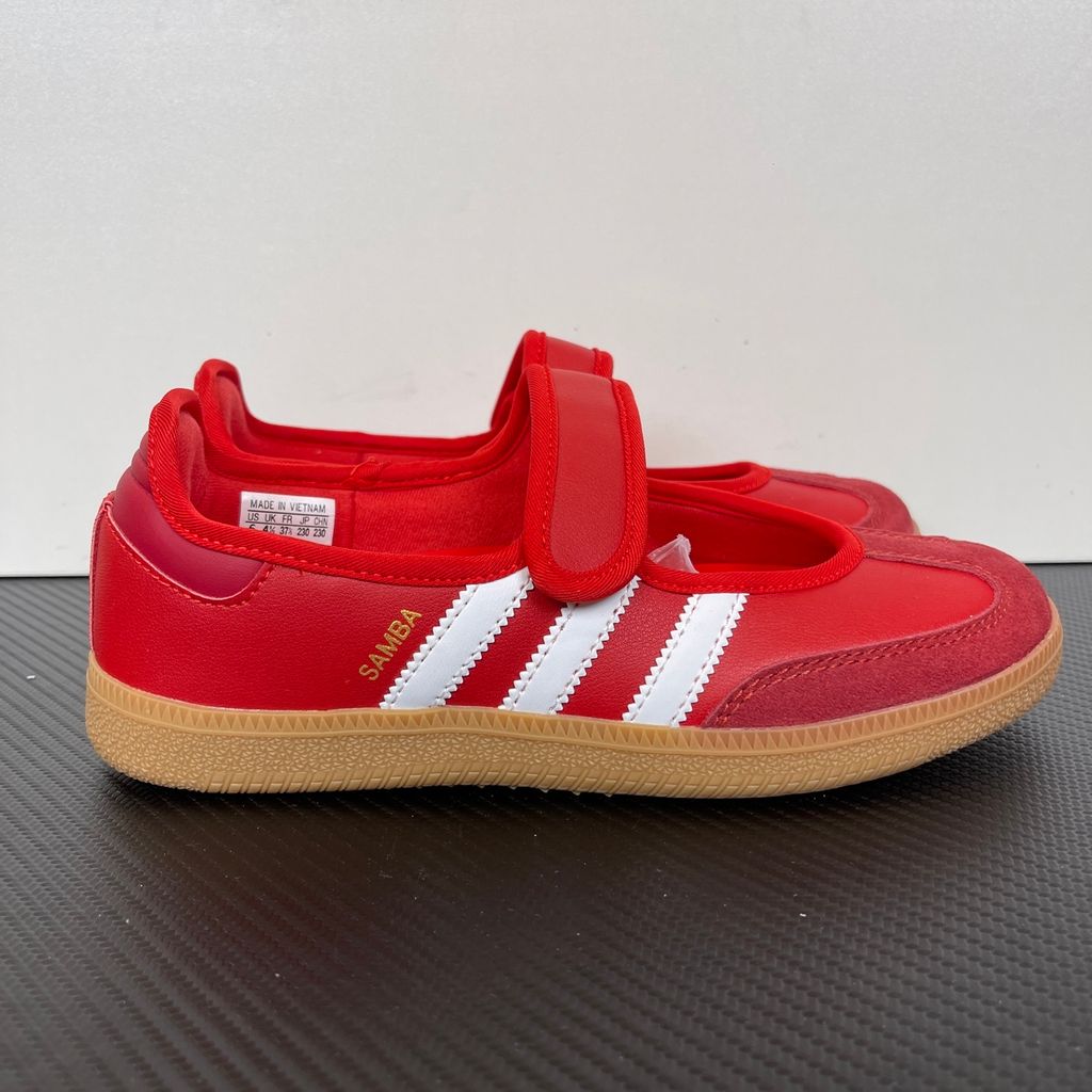 Side profile of the adidas Samba Jane Scarlet White Gum Women's sneaker JQ6446, featuring a vibrant red leather upper, crisp white serrated 3-Stripes, an adjustable midfoot strap, and a classic gum rubber outsole. Available in Singapore and Malaysia..jpg