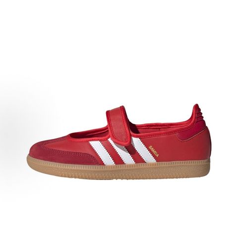 Side profile of the adidas Samba Jane Scarlet White Gum Women's sneaker JQ6446, featuring a vibrant red leather upper, crisp white serrated 3-Stripes, an adjustable midfoot strap, and a classic gum rubber outsole. Available in Singapore and Malaysia.