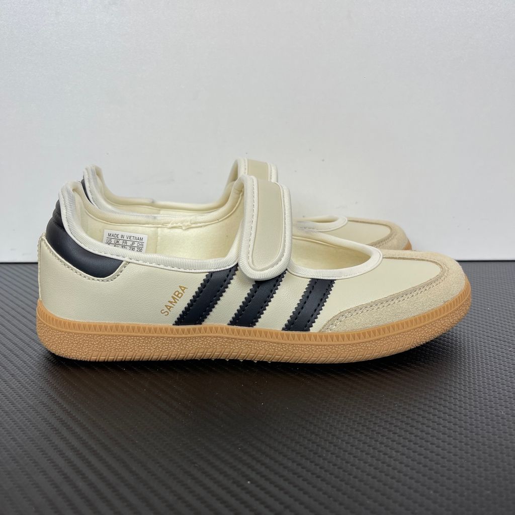 Side profile of the adidas Samba Jane Cream Black Gum Women's sneaker JR7338, featuring a soft cream leather upper, bold black serrated 3-Stripes, an adjustable midfoot strap, and a classic gum rubber outsole. Available in Singapore and Malaysia..jpg
