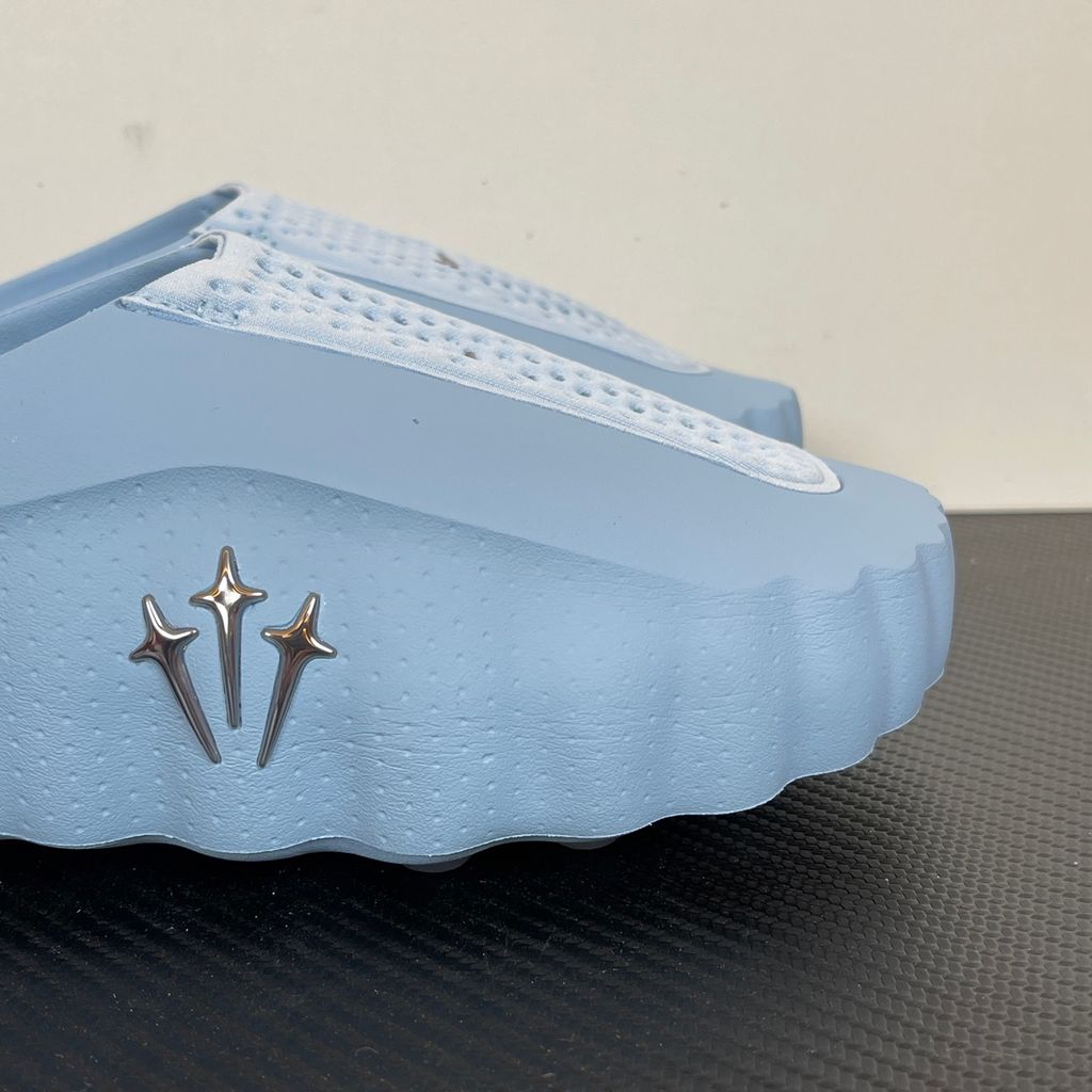 Shop the authentic NOCTA x Nike Mind 001 "Ice Blue." Featuring premium foam cushioning, chrome North Star hardware, and a futuristic sculpted design. Add to cart for the ultimate luxury slide staple perfect for the SG & MY urban lifestyle.