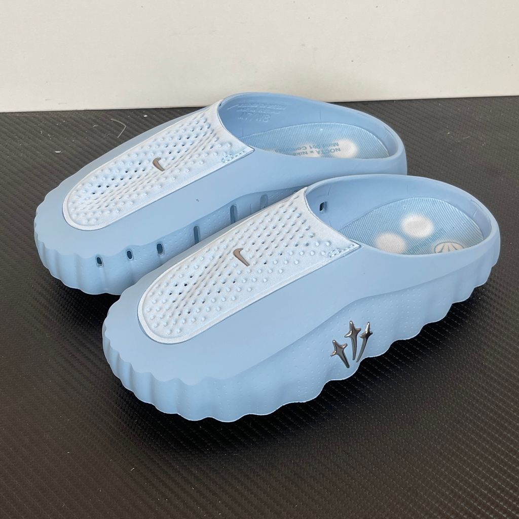 Shop the authentic NOCTA x Nike Mind 001 "Ice Blue." Featuring premium foam cushioning, chrome North Star hardware, and a futuristic sculpted design. Add to cart for the ultimate luxury slide staple perfect for the SG & MY urban lifestyle.