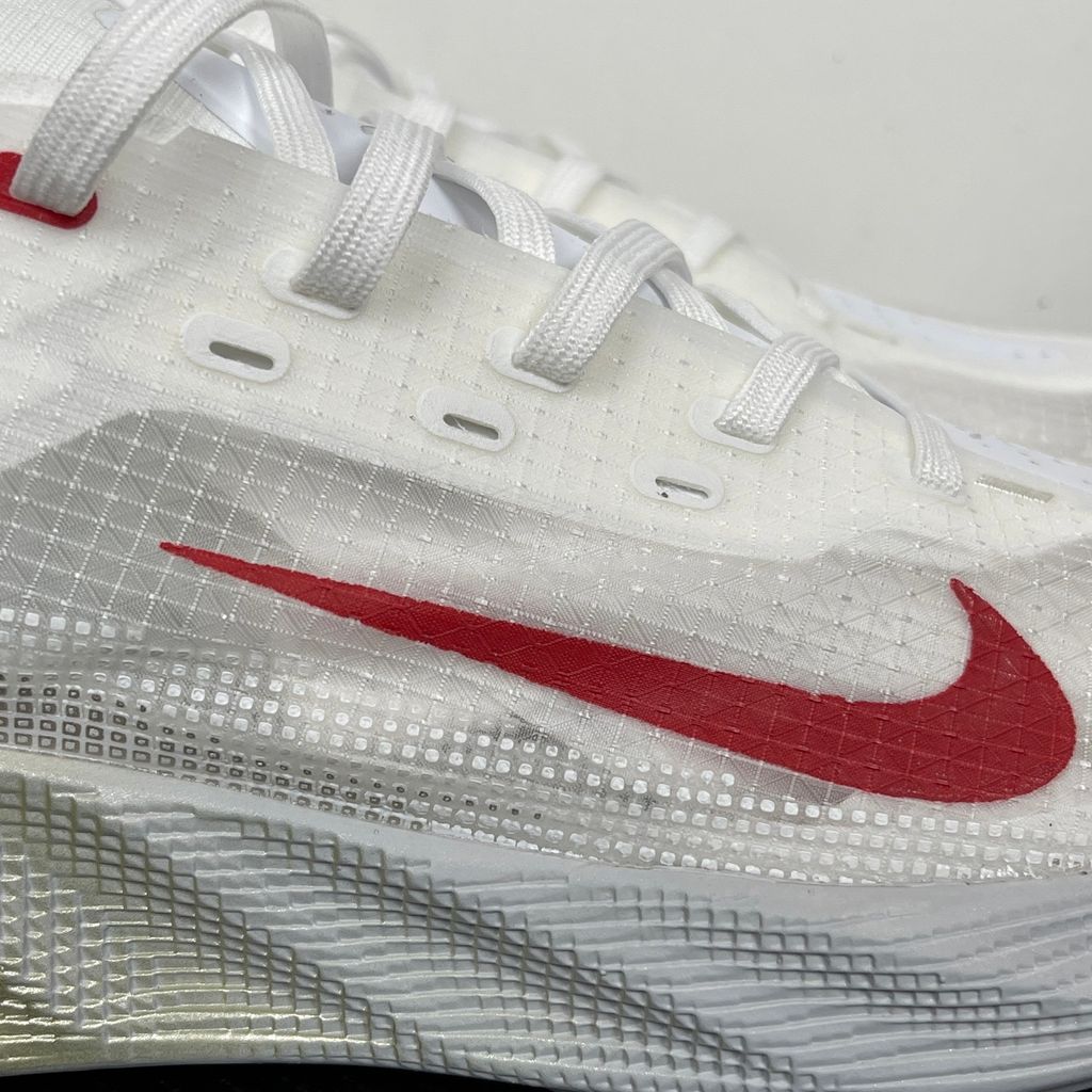 Nike Ava X retro running sneaker in Metallic Silver, Sail, and Midnight Navy, featuring a breathable mesh upper and responsive Cushlon midsole, SKU HM9697-003.