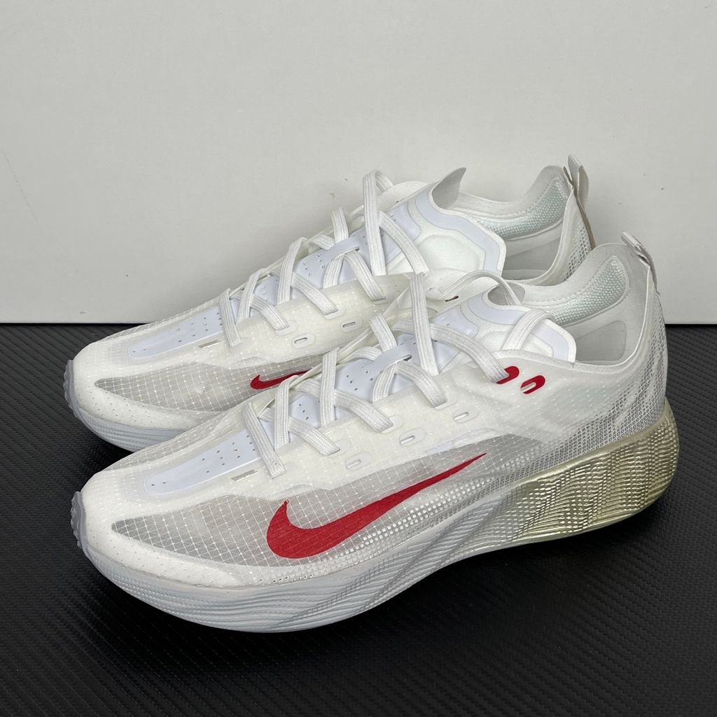 Nike Ava X retro running sneaker in Metallic Silver, Sail, and Midnight Navy, featuring a breathable mesh upper and responsive Cushlon midsole, SKU HM9697-003.