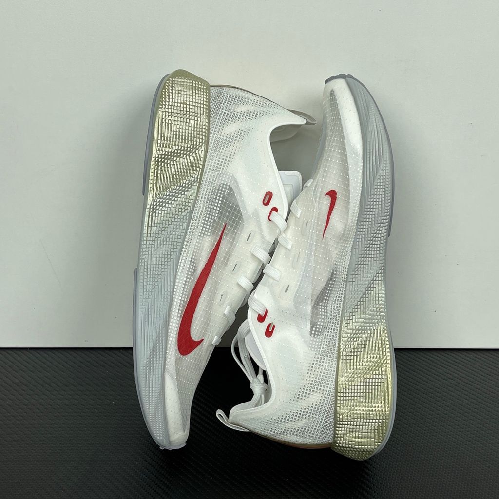 Nike Ava X retro running sneaker in Metallic Silver, Sail, and Midnight Navy, featuring a breathable mesh upper and responsive Cushlon midsole, SKU HM9697-003.