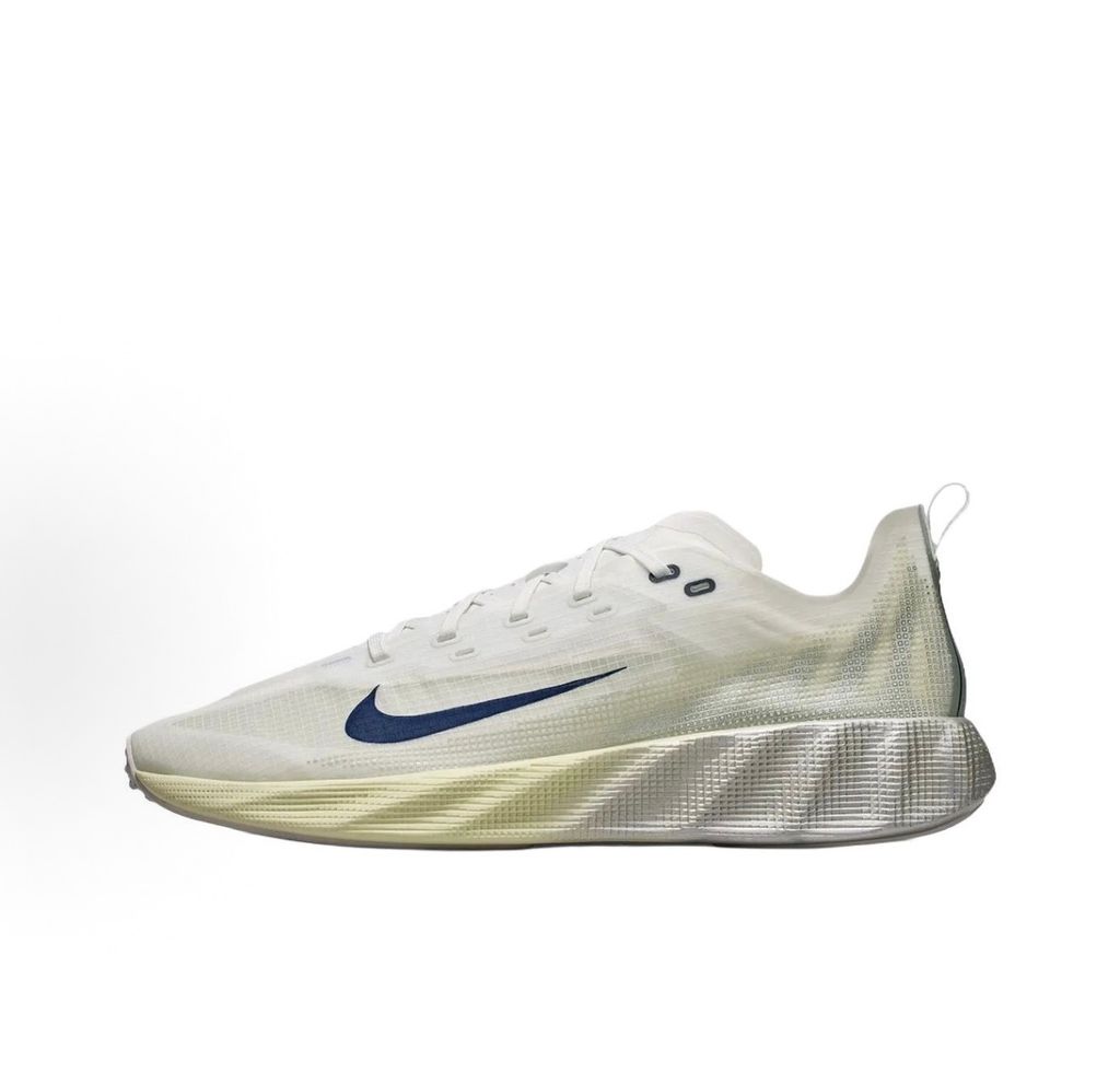 Nike Ava X retro running sneaker in Metallic Silver, Alabaster, and Midnight Navy, featuring a breathable mesh upper and responsive Cushlon midsole, SKU HM9697-003.