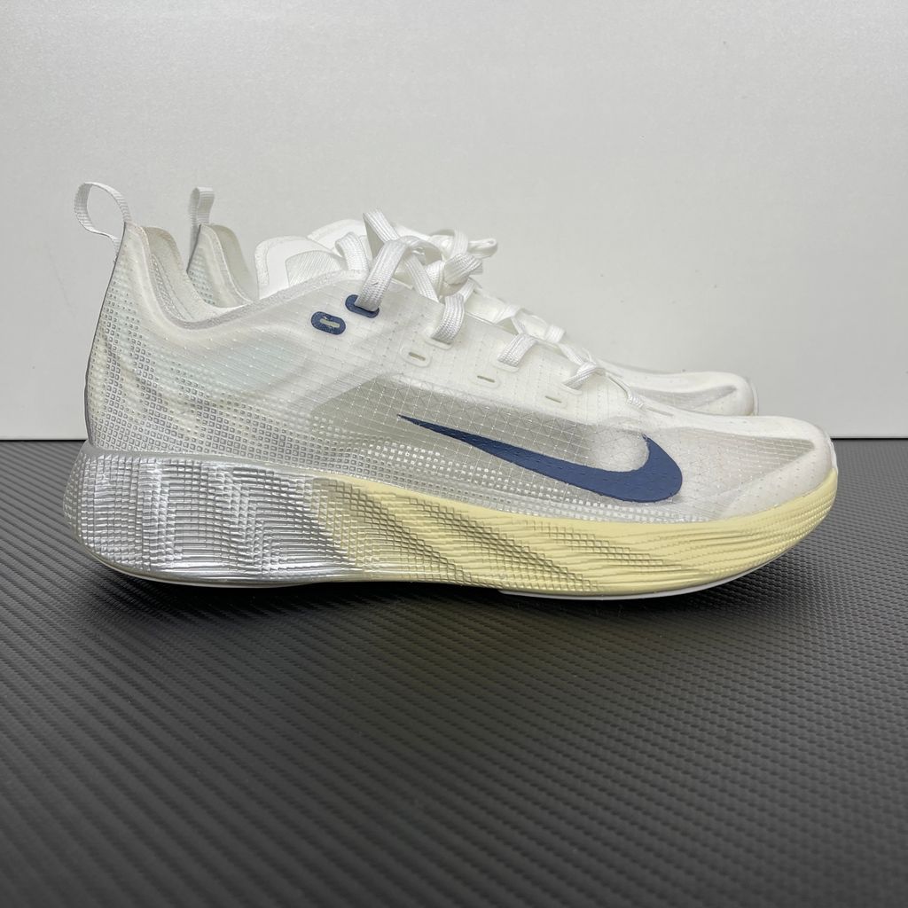Nike Ava X retro running sneaker in Metallic Silver, Alabaster, and Midnight Navy, featuring a breathable mesh upper and responsive Cushlon midsole, SKU HM9697-003.