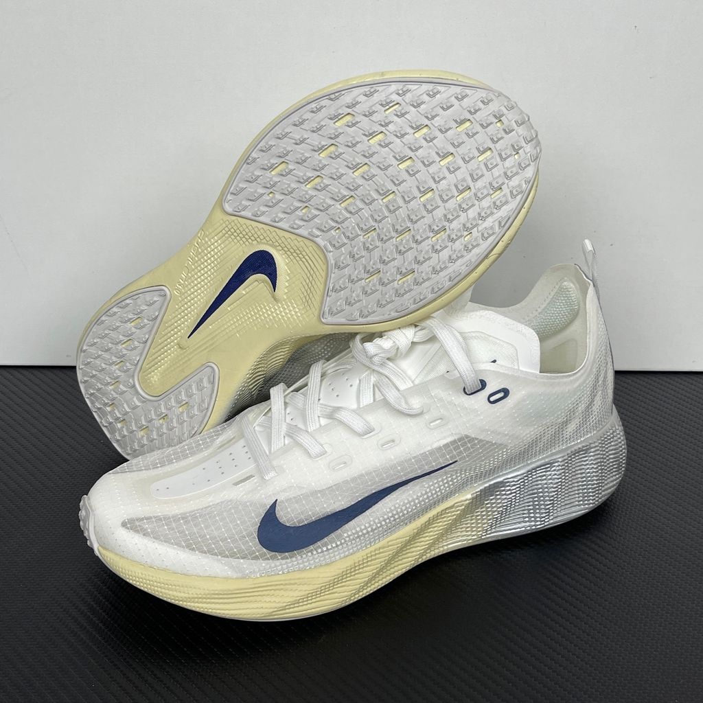 Nike Ava X retro running sneaker in Metallic Silver, Alabaster, and Midnight Navy, featuring a breathable mesh upper and responsive Cushlon midsole, SKU HM9697-003.