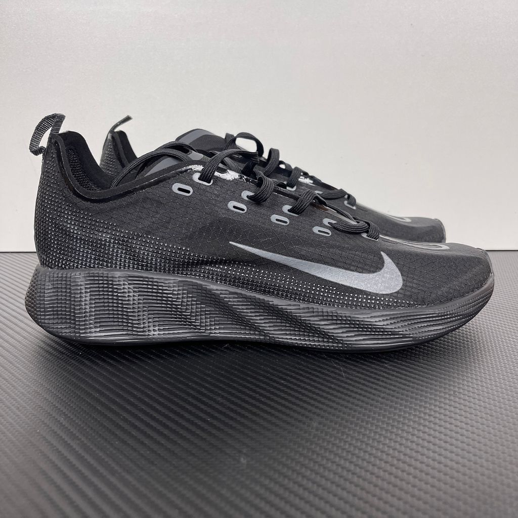 Nike Ava X lightweight running sneaker in stealth Black and Anthracite, featuring a breathable mesh upper and blacked-out Cushlon midsole, SKU HM9697-004.