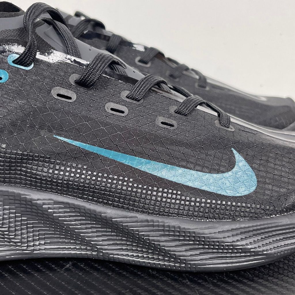 Nike Ava X lightweight running sneaker in Anthracite and Black with vibrant Energy accents, featuring a breathable mesh upper and Cushlon midsole, SKU HM9697-006.