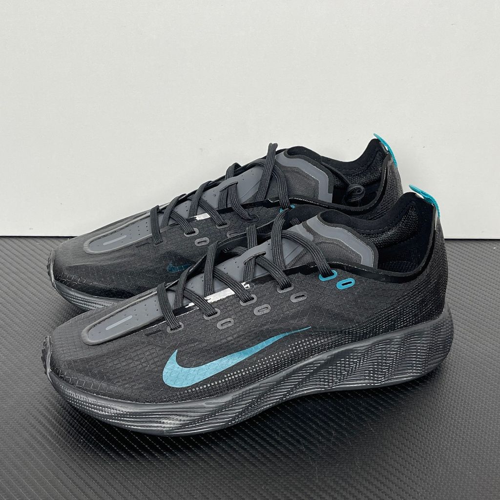Nike Ava X lightweight running sneaker in Anthracite and Black with vibrant Energy accents, featuring a breathable mesh upper and Cushlon midsole, SKU HM9697-006.