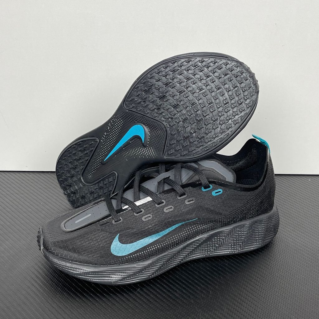 Nike Ava X lightweight running sneaker in Anthracite and Black with vibrant Energy accents, featuring a breathable mesh upper and Cushlon midsole, SKU HM9697-006.
