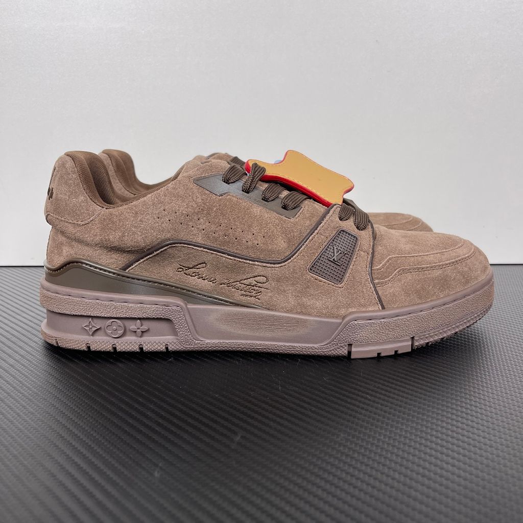 Tyler, The Creator x Louis Vuitton LV Trainer in deep brown suede, featuring the signature Louis Vuitton script on the side panel, monogram flowers on the midsole, and a custom colorful wavy lace tag..jpg
