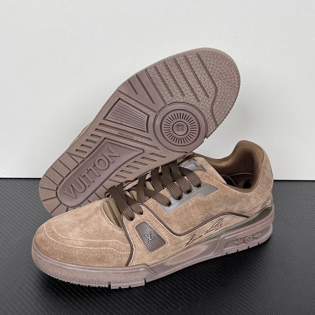 Tyler, The Creator x Louis Vuitton LV Trainer in deep brown suede, featuring the signature Louis Vuitton script on the side panel, monogram flowers on the midsole, and a custom colorful wavy lace tag..jpg