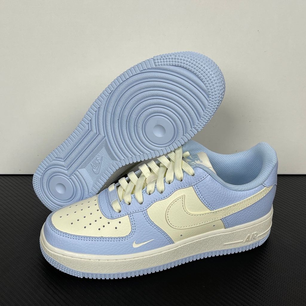 Nike Women's Air Force 1 '07 sneaker in Hydrogen Blue and Soft Pearl, featuring textured tumbled leather overlays, a cream Swoosh, and a mini embroidered Swoosh, SKU IV3222-400.