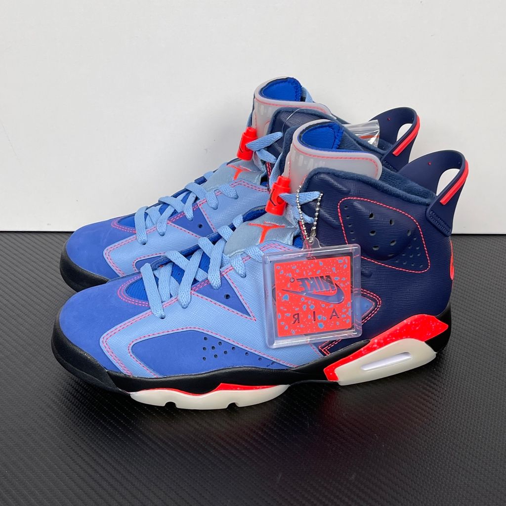 Limited edition Jordan 6 Retro x Awake NY collaboration sneaker in Midnight Navy, featuring a premium nubuck upper and visible Air cushioning, SKU IQ5706-400.