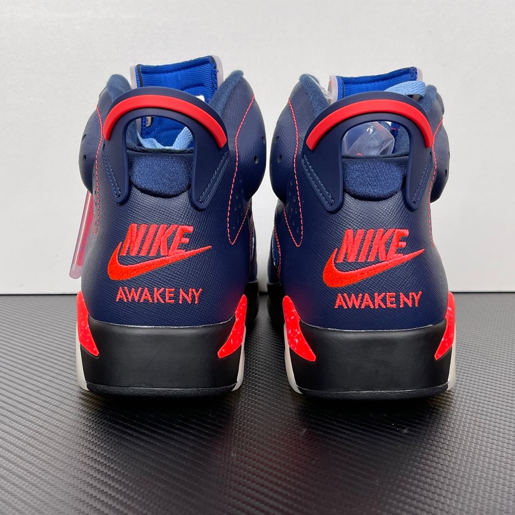 Limited edition Jordan 6 Retro x Awake NY collaboration sneaker in Midnight Navy, featuring a premium nubuck upper and visible Air cushioning, SKU IQ5706-400.