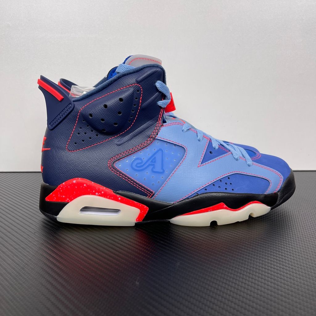 Limited edition Jordan 6 Retro x Awake NY collaboration sneaker in Midnight Navy, featuring a premium nubuck upper and visible Air cushioning, SKU IQ5706-400.