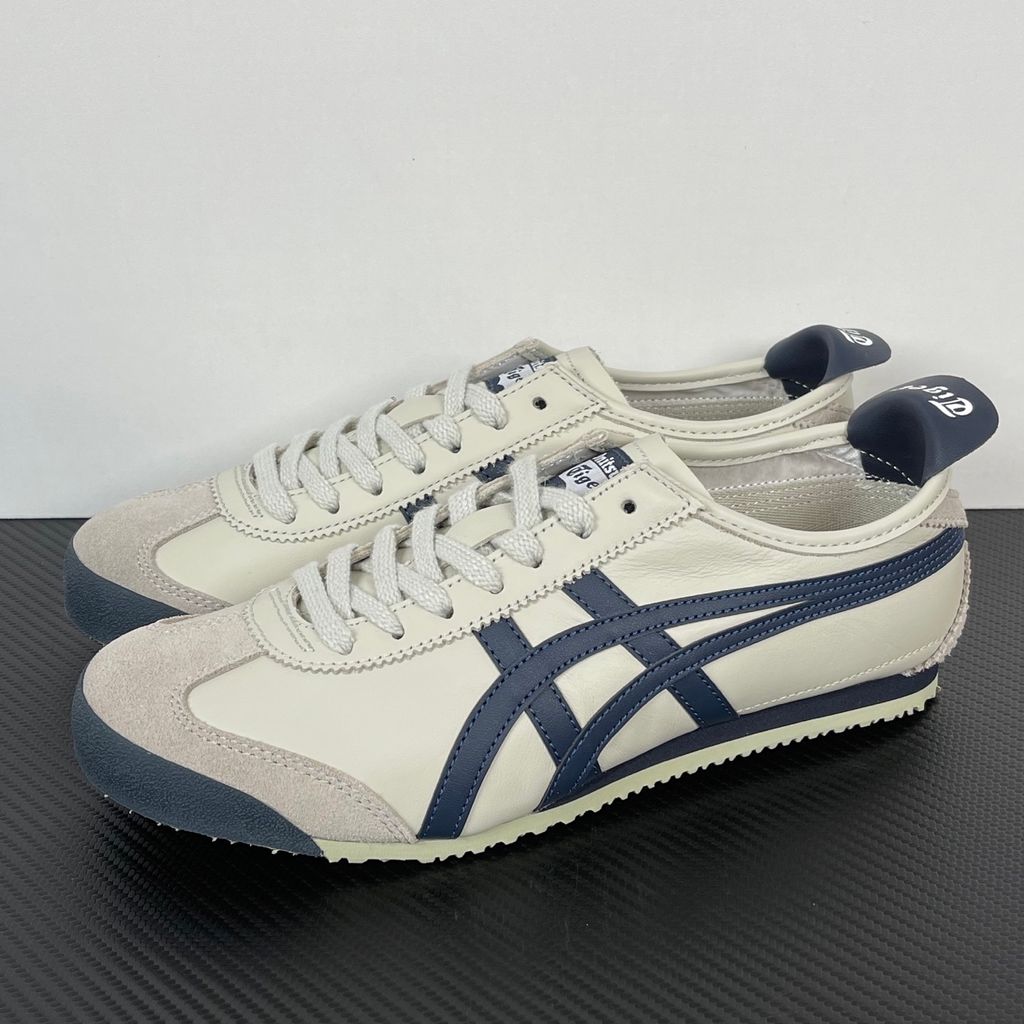 Onitsuka Tiger Mexico 66 vintage running sneaker in Birch and Peacoat navy, featuring a cream leather upper and signature side stripes, SKU 1183C102-200.
