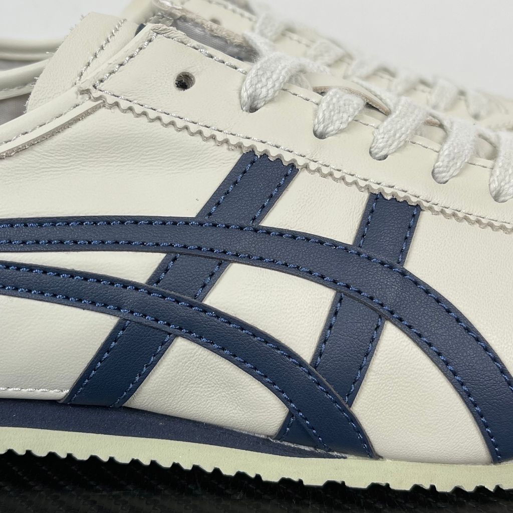 Onitsuka Tiger Mexico 66 vintage running sneaker in Birch and Peacoat navy, featuring a cream leather upper and signature side stripes, SKU 1183C102-200.