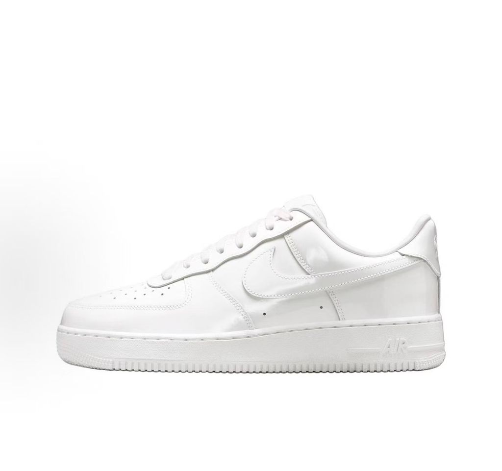 Nike Air Force 1 Low '07 Premium sneaker in high-gloss White Patent leather, featuring a tonal white Swoosh and classic chunky rubber sole, SKU IV2857-100.