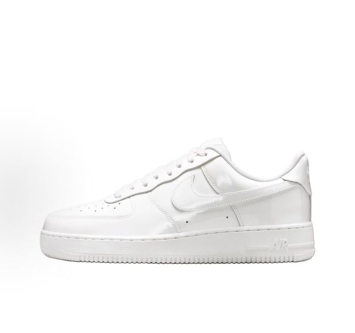 Nike Air Force 1 Low '07 Premium sneaker in high-gloss White Patent leather, featuring a tonal white Swoosh and classic chunky rubber sole, SKU IV2857-100.