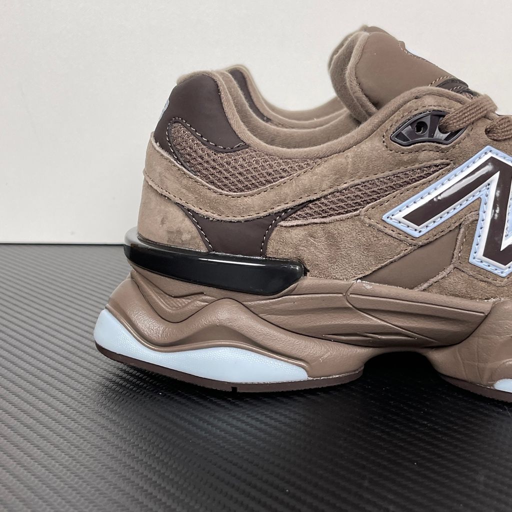 New Balance 9060 chunky retro-futuristic sneaker in rich brown and icy blue, featuring a premium suede and mesh upper, SKU U9060622.