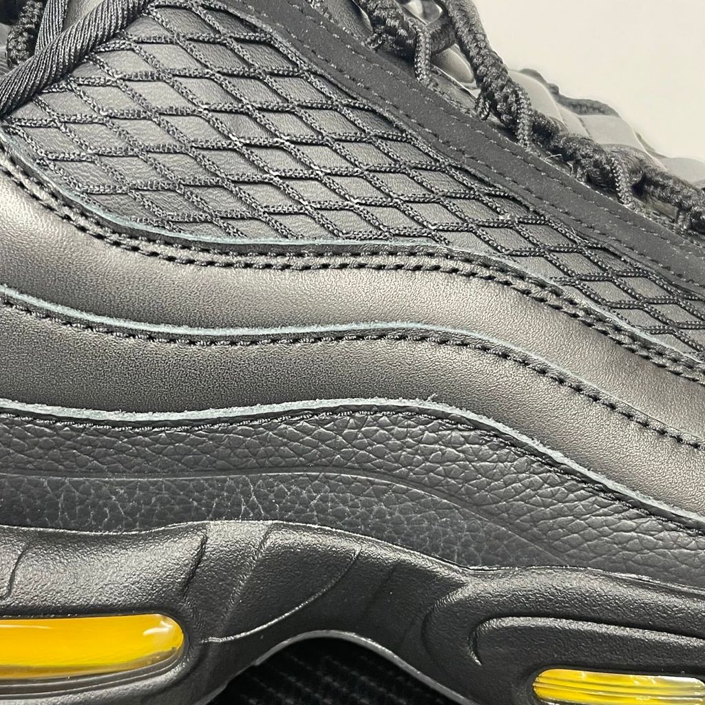 Limited edition Nike Air Max 95 x Corteiz (CRTZ RTW) sneaker in Honey and Black, featuring premium leather overlays, netted mesh, and visible Air units, SKU FB2709-003.