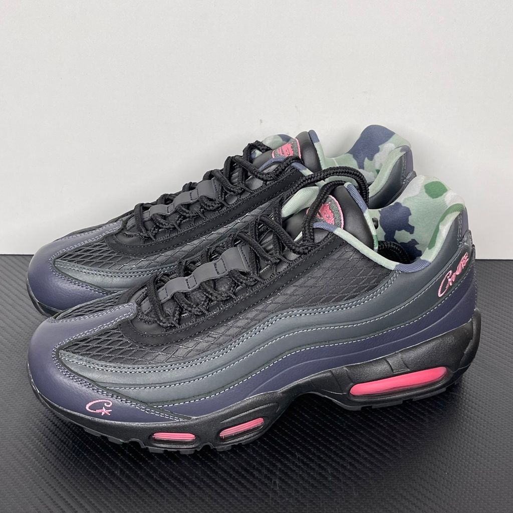 Limited edition Nike Air Max 95 SP x Corteiz (CRTZ RTW) sneaker in Black and Pink Beam, featuring premium leather overlays, netted mesh, and neon pink visible Air units, SKU FB2709-001.