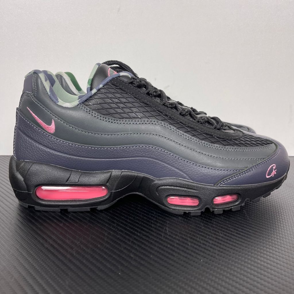 Limited edition Nike Air Max 95 SP x Corteiz (CRTZ RTW) sneaker in Black and Pink Beam, featuring premium leather overlays, netted mesh, and neon pink visible Air units, SKU FB2709-001.